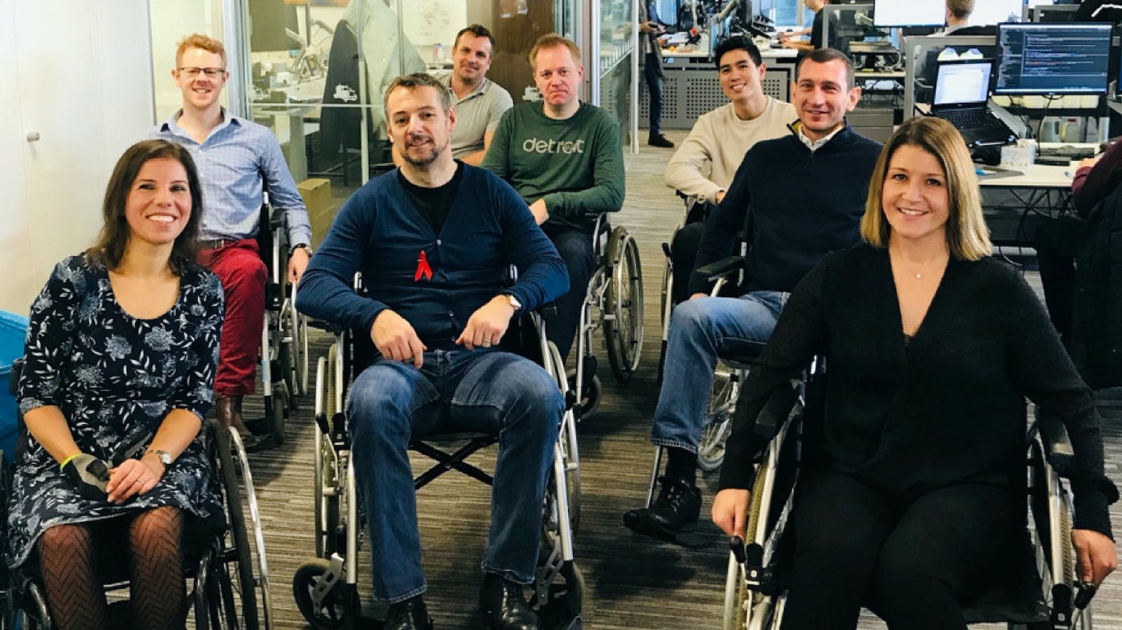 Alfa team members in wheelchairs